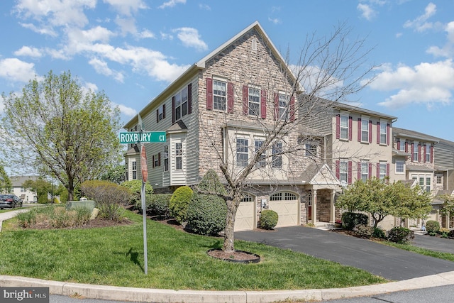1901 Roxbury Ct, Mechanicsburg, PA 17055 - townhome / multi-family property with a garage, a front lawn, driveway, and stone siding