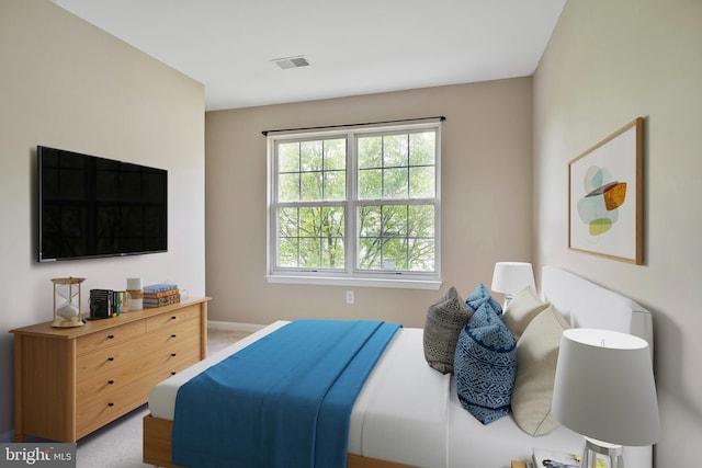 bedroom featuring visible vents and baseboards