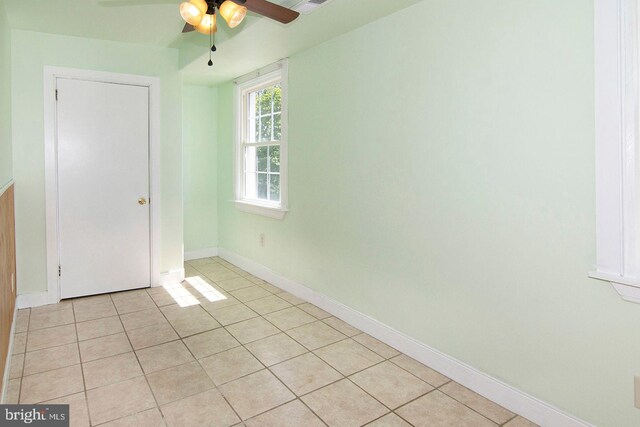 330 E Broadway, Salem, NJ 08079 - unfurnished bedroom with baseboards, a ceiling fan, and light tile patterned floors