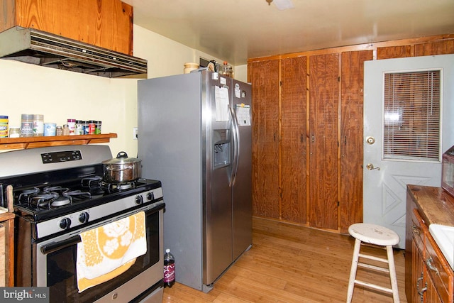 330 E Broadway, Salem, NJ 08079 - kitchen with light wood-style floors, appliances with stainless steel finishes, brown cabinetry, and under cabinet range hood