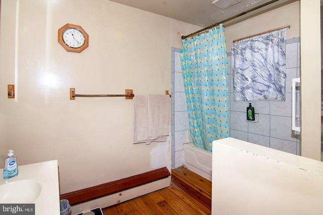 330 E Broadway, Salem, NJ 08079 - full bath with visible vents, shower / bath combination with curtain, tile walls, wood finished floors, and vanity