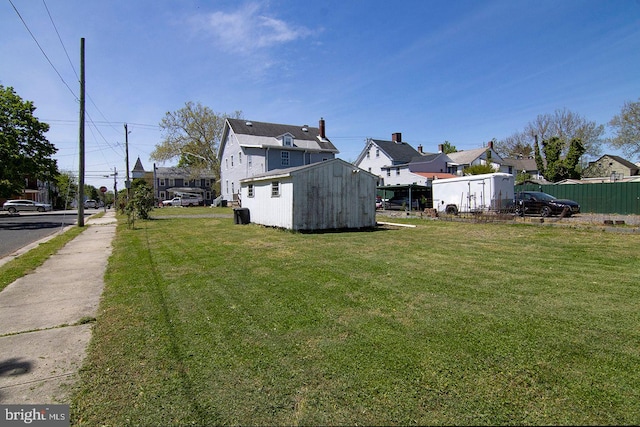 330 E Broadway, Salem, NJ 08079 - view of yard with an outbuilding, fence, a storage shed, and a residential view
