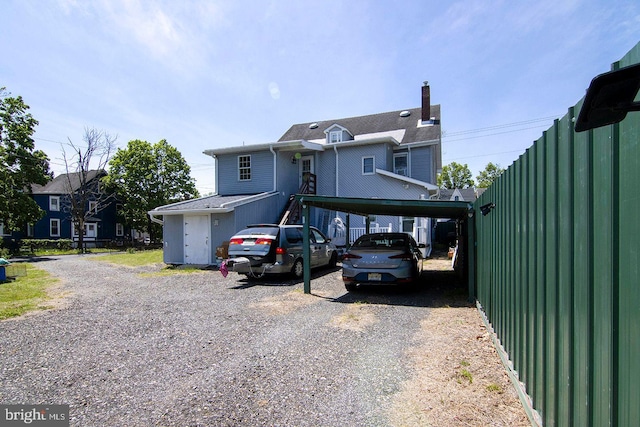 330 E Broadway, Salem, NJ 08079 - view of front of house featuring a carport, a chimney, and driveway