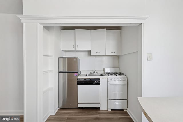 kitchen featuring a sink, light countertops, white appliances, and dark wood-type flooring