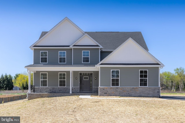 craftsman inspired home with stone siding and covered porch