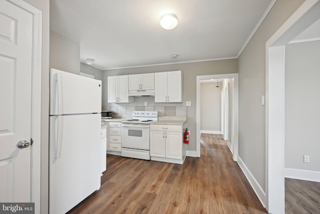 673 Harrisonville Rd, Swedesboro, NJ 08085 - kitchen with white cabinetry, wood finished floors, white appliances, light countertops, and under cabinet range hood