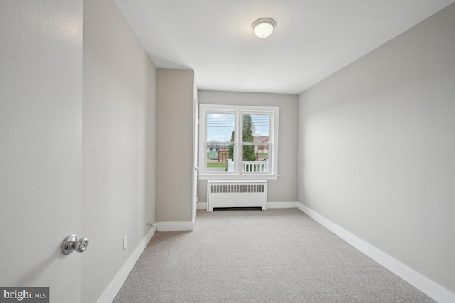 673 Harrisonville Rd, Swedesboro, NJ 08085 - spare room featuring radiator heating unit, baseboards, and light carpet