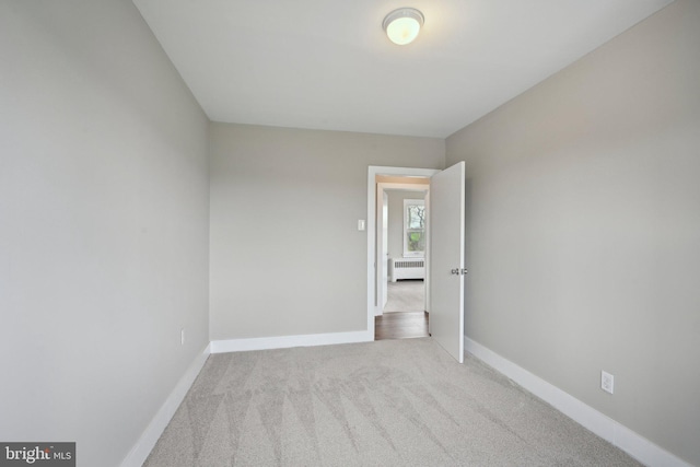 673 Harrisonville Rd, Swedesboro, NJ 08085 - spare room featuring baseboards, radiator heating unit, and carpet