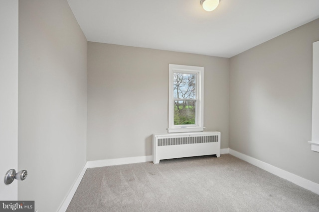 673 Harrisonville Rd, Swedesboro, NJ 08085 - carpeted spare room with baseboards and radiator heating unit