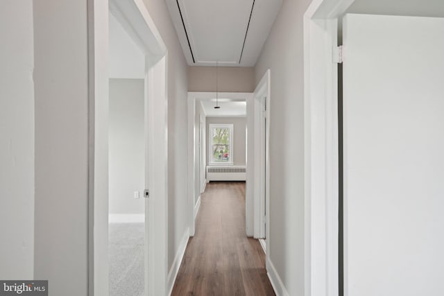 673 Harrisonville Rd, Swedesboro, NJ 08085 - hallway with attic access, radiator, baseboards, and dark wood-style flooring