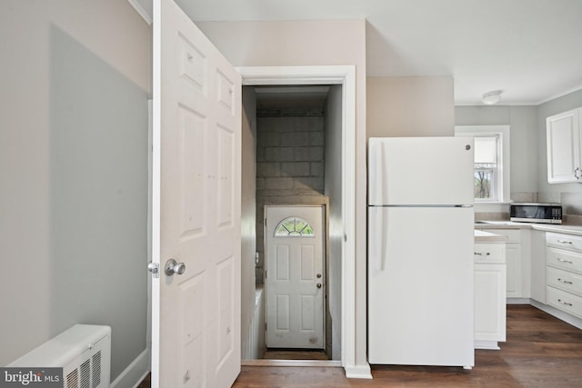 673 Harrisonville Rd, Swedesboro, NJ 08085 - kitchen featuring stainless steel microwave, freestanding refrigerator, white cabinets, and dark wood-style flooring