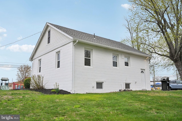 673 Harrisonville Rd, Swedesboro, NJ 08085 - view of side of home with a yard and a shingled roof
