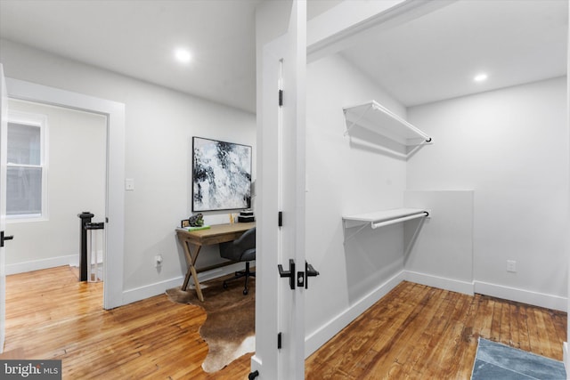 walk in closet featuring hardwood / wood-style floors