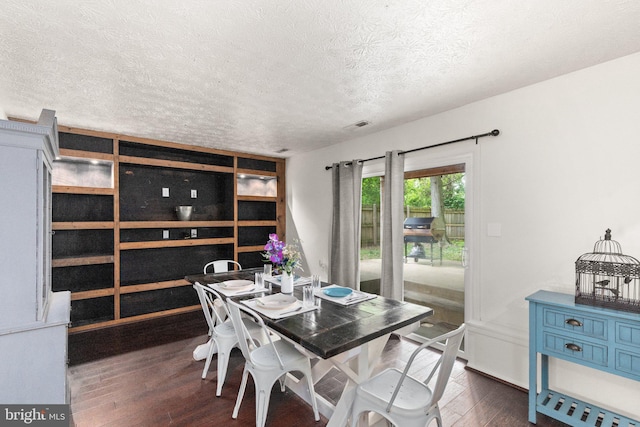 1276 Courtney Ln, Belcamp, MD 21017 - dining room featuring a textured ceiling and dark wood-type flooring