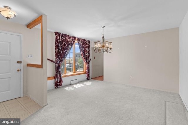 unfurnished dining area with carpet and a notable chandelier