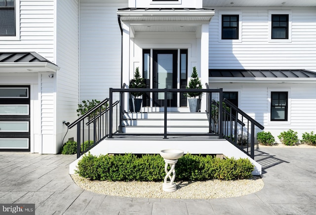1181 Jennifer Ln, Manahawkin, NJ 08050 - doorway to property with a standing seam roof, metal roof, and a garage