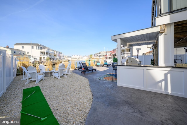 1181 Jennifer Ln, Manahawkin, NJ 08050 - exterior space with an outdoor kitchen, fence, a residential view, and a patio