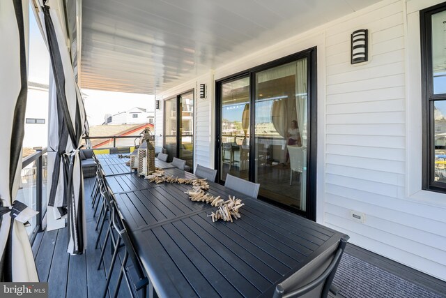 1181 Jennifer Ln, Manahawkin, NJ 08050 - wooden terrace with covered porch and outdoor dining space