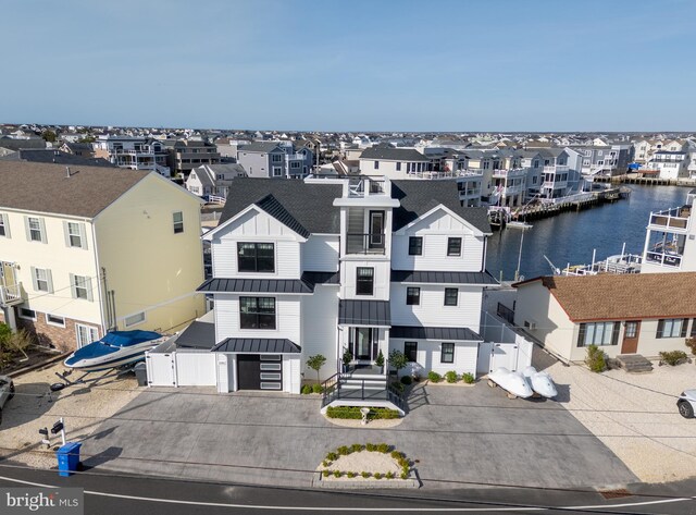 1181 Jennifer Ln, Manahawkin, NJ 08050 - exterior space featuring fence private yard, a gate, a water view, and a standing seam roof