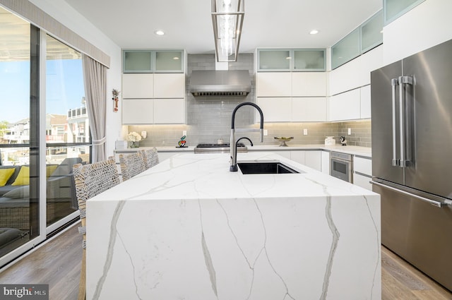 1181 Jennifer Ln, Manahawkin, NJ 08050 - kitchen featuring modern cabinets, backsplash, stainless steel appliances, and light wood-style flooring