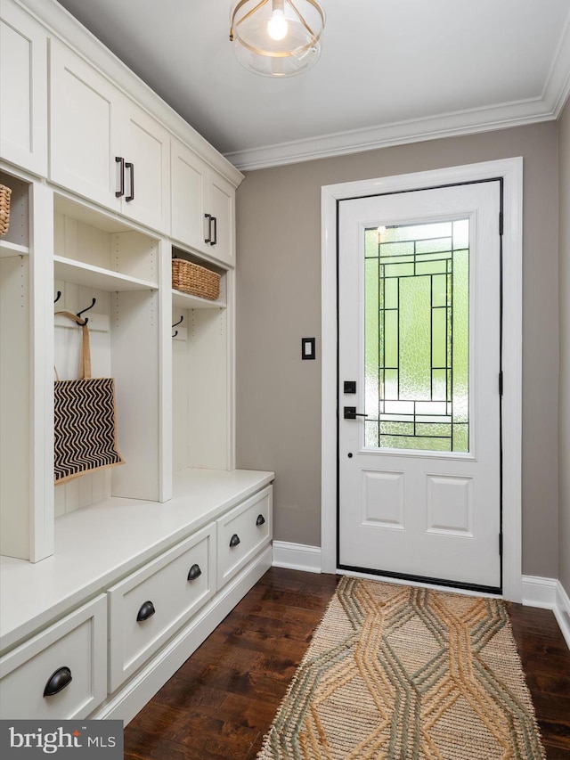 mudroom featuring baseboards, ornamental molding, and dark wood finished floors