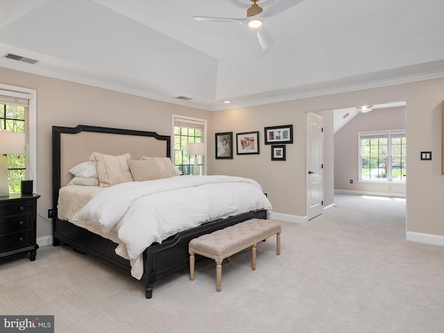 bedroom featuring crown molding, light colored carpet, baseboards, lofted ceiling, and visible vents