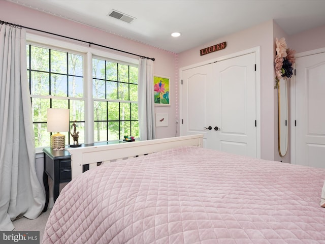 bedroom featuring a closet, recessed lighting, and visible vents