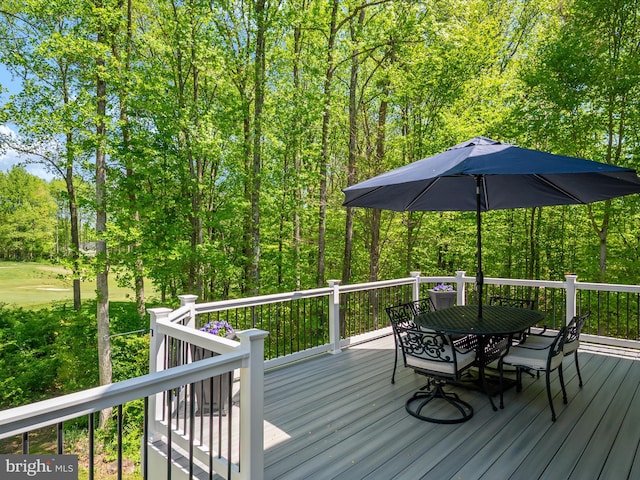 wooden deck with outdoor dining area
