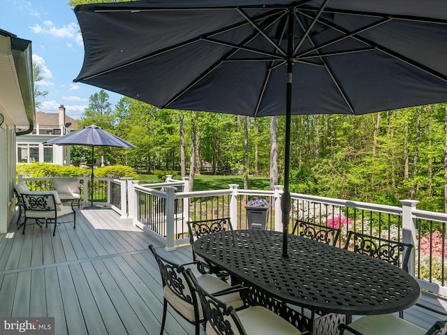 wooden deck with outdoor dining space