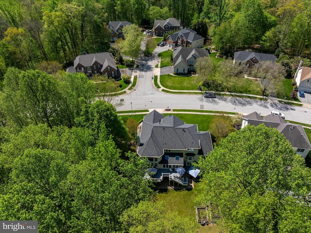 bird's eye view with a view of trees and a residential view