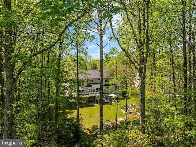 exterior space featuring a view of trees