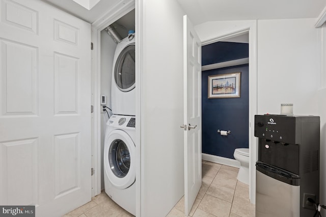 421 N 20th St, Philadelphia, PA 19130 - washroom featuring stacked washer / drying machine, light tile patterned floors, and baseboards