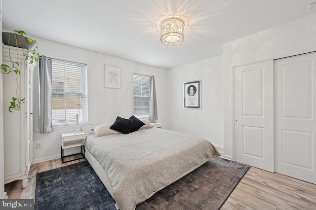 421 N 20th St, Philadelphia, PA 19130 - bedroom featuring light wood-style floors, multiple windows, and baseboards