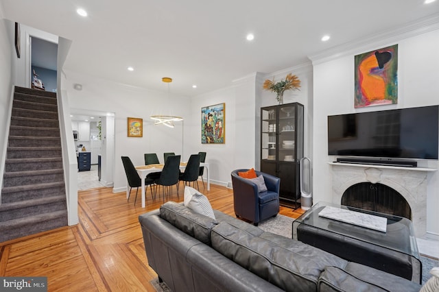 421 N 20th St, Philadelphia, PA 19130 - living room with stairway, ornamental molding, recessed lighting, a fireplace, and baseboards