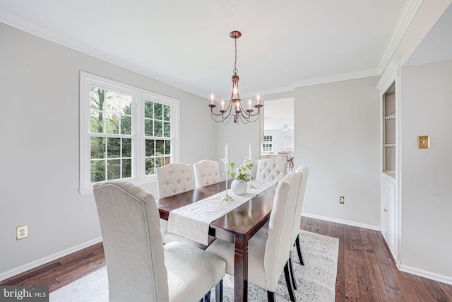 dining space featuring baseboards, ornamental molding, dark wood-style floors, and a notable chandelier