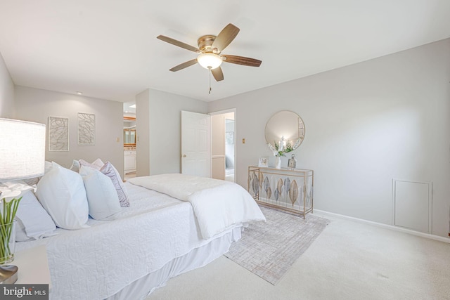 carpeted bedroom featuring baseboards and a ceiling fan