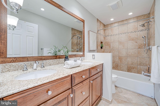 full bath with a sink, tile patterned flooring, shower / bath combination, and double vanity