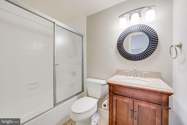 full bathroom featuring toilet, enclosed tub / shower combo, and vanity