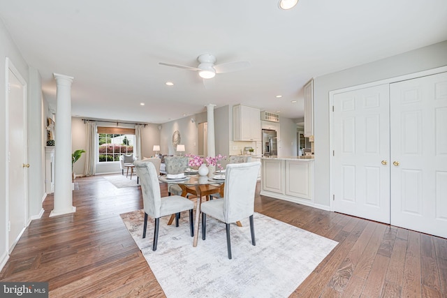 dining room with ornate columns, recessed lighting, ceiling fan, and wood finished floors