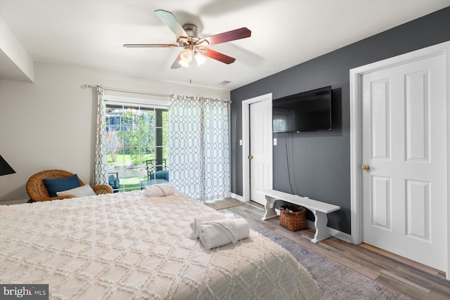 bedroom with ceiling fan, baseboards, access to outside, and wood finished floors
