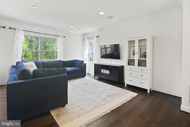 living area featuring recessed lighting, baseboards, ornamental molding, and dark wood-type flooring