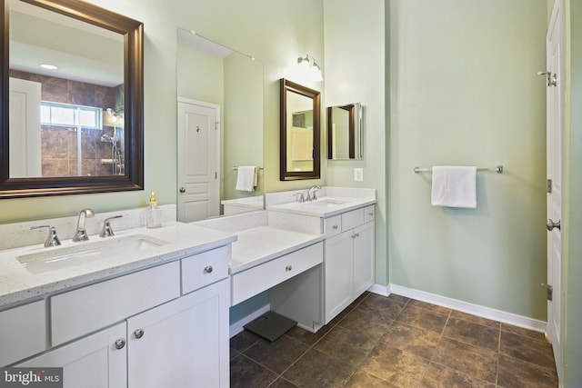 bathroom with baseboards and vanity