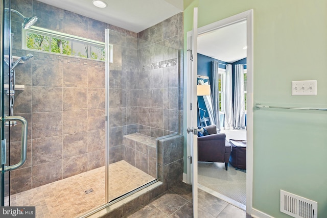 ensuite bathroom featuring visible vents, a stall shower, ensuite bath, and tile patterned flooring