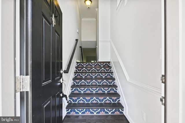 staircase with crown molding