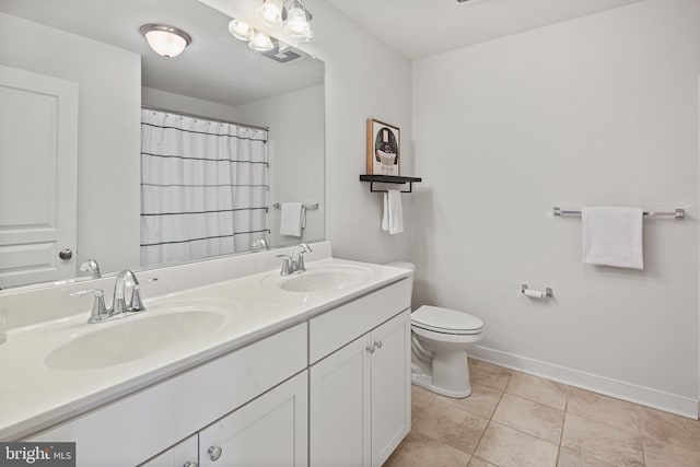 full bathroom with baseboards, a sink, double vanity, and toilet