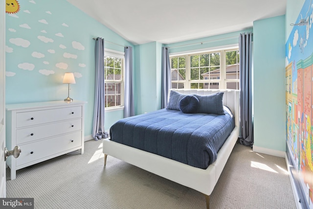 bedroom with baseboards, carpet flooring, and lofted ceiling