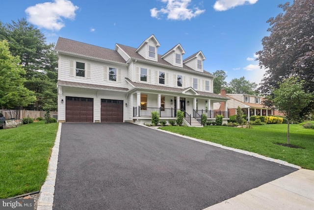 38 Birchall Dr, Haddonfield, NJ 08033 - view of front of house featuring a porch, asphalt driveway, and a garage