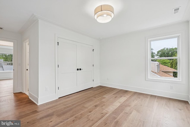 38 Birchall Dr, Haddonfield, NJ 08033 - unfurnished bedroom with light wood-style flooring, crown molding, and a closet