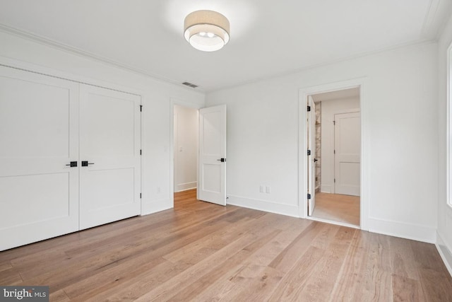 38 Birchall Dr, Haddonfield, NJ 08033 - unfurnished bedroom with light wood-type flooring, crown molding, and a closet