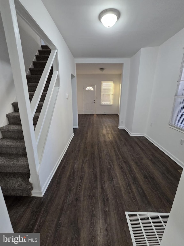 810 Mohn St, Harrisburg, PA 17113 - corridor featuring stairway, wood finished floors, and baseboards